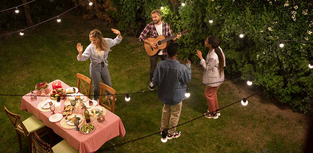 outdoor party at night with hanging lights